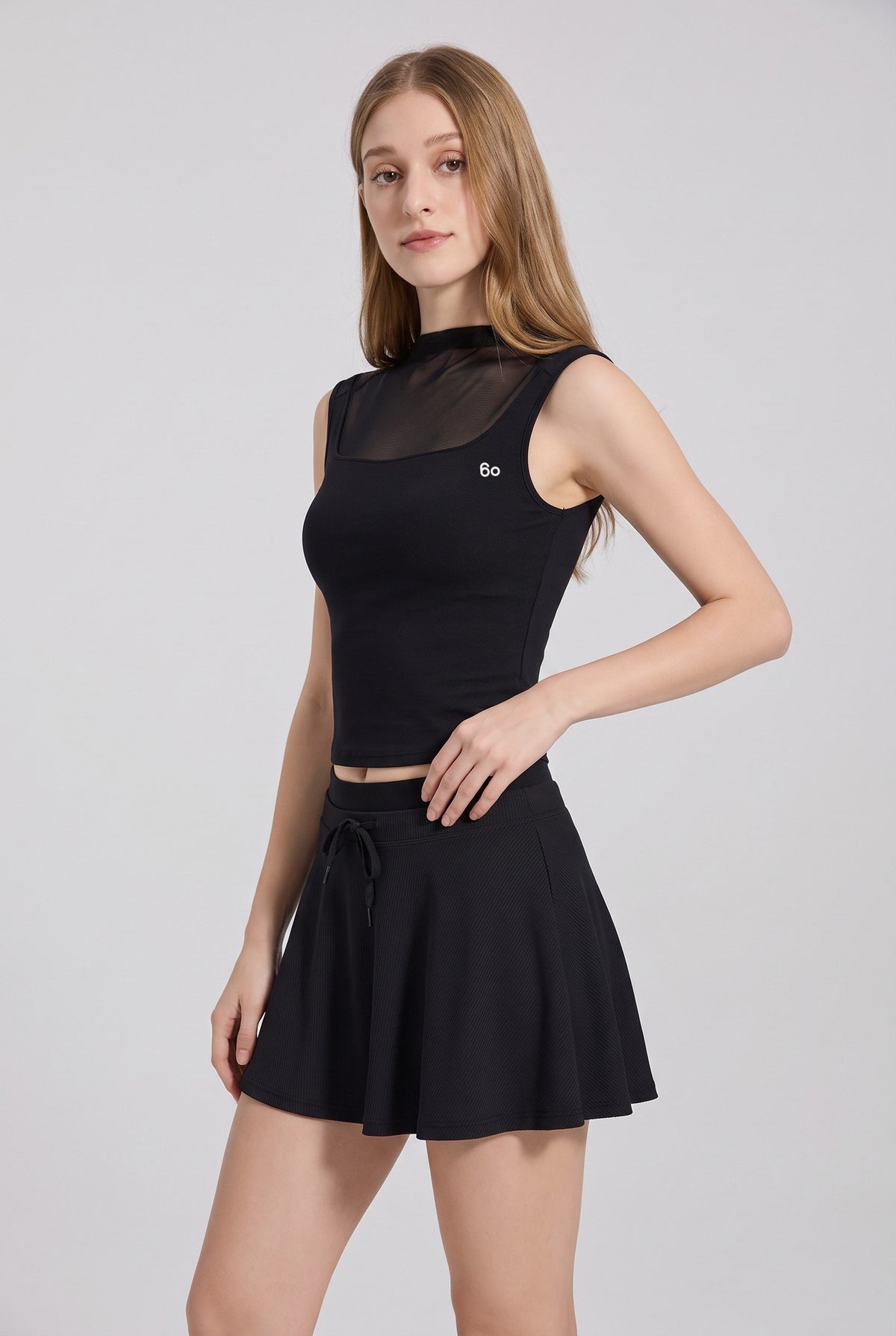 MAYA mesh tank & pleated skirt set in Black – women's padel set by Six'o – studio photo