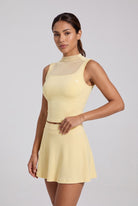 MAYA mesh tank & pleated skirt set in Pear yellow – women's padel set by Six'o – studio photo