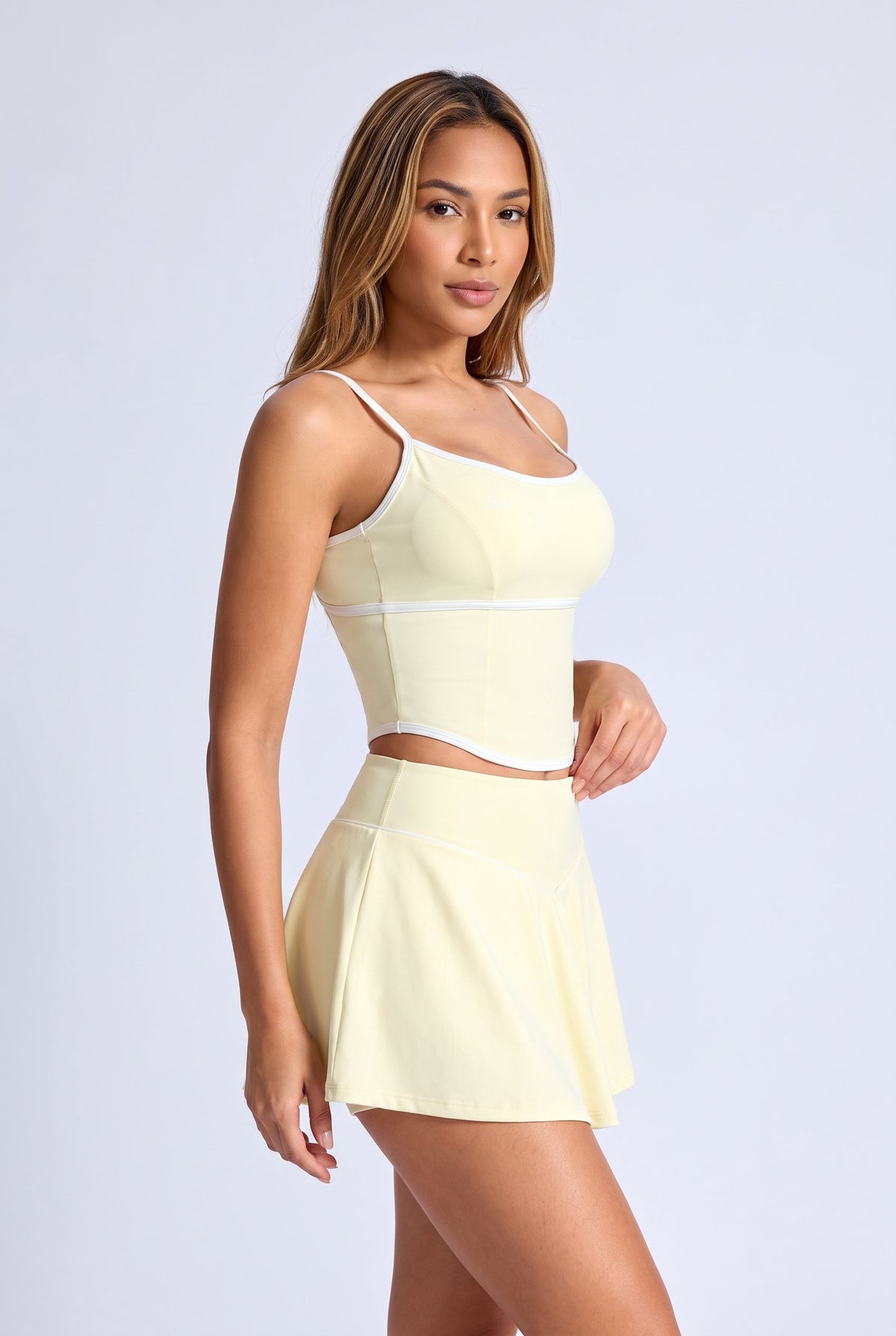 NINA cami top & flare skirt set in Pear yellow – women's padel set by Six'o – studio photo