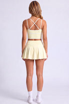 NINA cami top & flare skirt set in Pear yellow – women's padel set by Six'o – back view