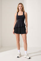 NOVA layered ruffle padel dress in Black – women's padel dress by Six'o – front view