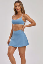 OLIVIA strap bra & skirt set in Cloisonne blue – women's padel set by Six'o – studio photo