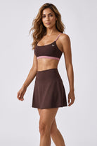 OLIVIA strap bra & skirt set in Dark brown – women's padel set by Six'o – full-length studio photo