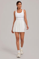 RUBY piped tank pleated dress in White – women's padel dress by Six'o – full-length studio photo
