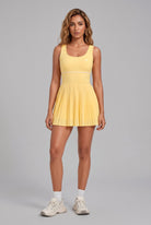 RUBY piped tank pleated dress in Yellow – women's padel dress by Six'o – front view