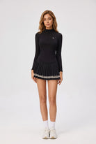 STELLA long sleeve & pleated skirt set in Black – women's padel set by Six'o – front view