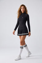 STELLA long sleeve & pleated skirt set in Black – women's padel set by Six'o – full-length studio photo