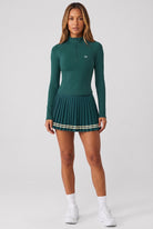 STELLA long sleeve & pleated skirt set in Dark green – women's padel set by Six'o – front view