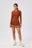 STELLA long sleeve & pleated skirt set in Rust red – women's padel set by Six'o – front view