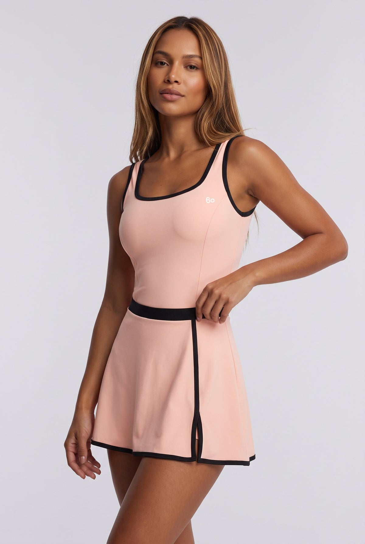 TARA tank top & trim skirt set in Peach – women's padel set by Six'o – studio photo