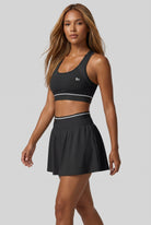 TESSA striped tank & pleated skirt set in Black – women's padel set by Six'o – full-length studio photo