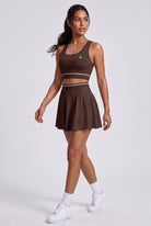 TESSA striped tank & pleated skirt set in Espresso brown – women's padel set by Six'o – full-length studio photo