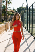 ZARA zip vest & leggings set in Red – women's padel set by Six'o – lifestyle photo at the padel club