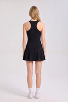 ZOE high neck padel dress in Black – women's padel dress by Six'o – back view